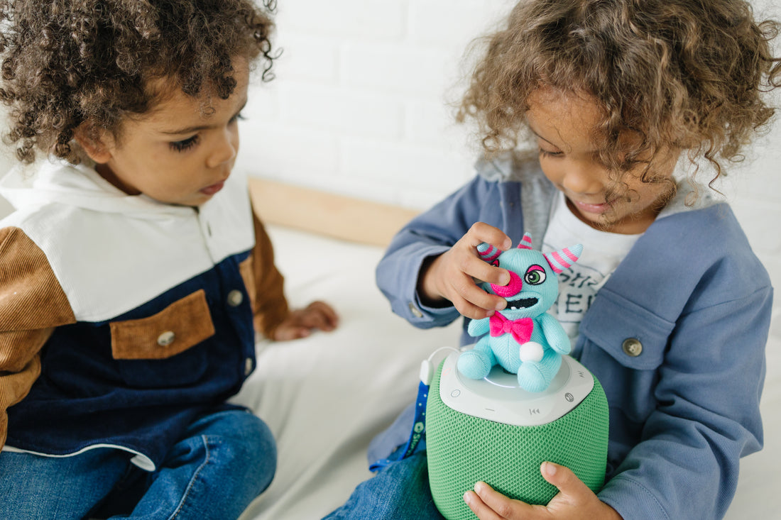 A pair of 3-year-old boys take turns playing with Storypod's Sugar Monster Craftie. Being able to manipulate items in one's hands is an important motor skill that children are still strengthening at this age.
