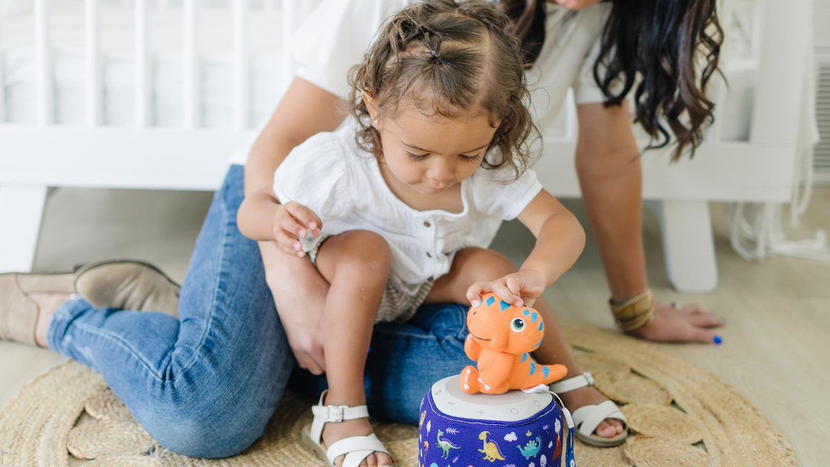 Toddler and mom listening to stories on the Storypod