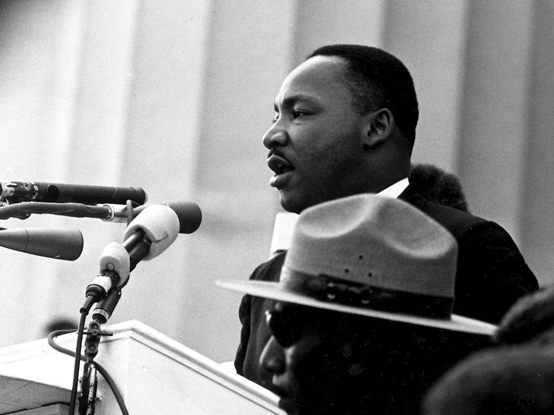 Martin Luther King makes his speech during the March of Washington. Listening to his "I Have a Dream" speech is one meaningful way to celebrate Martin Luther King Junior Day with your kids.
