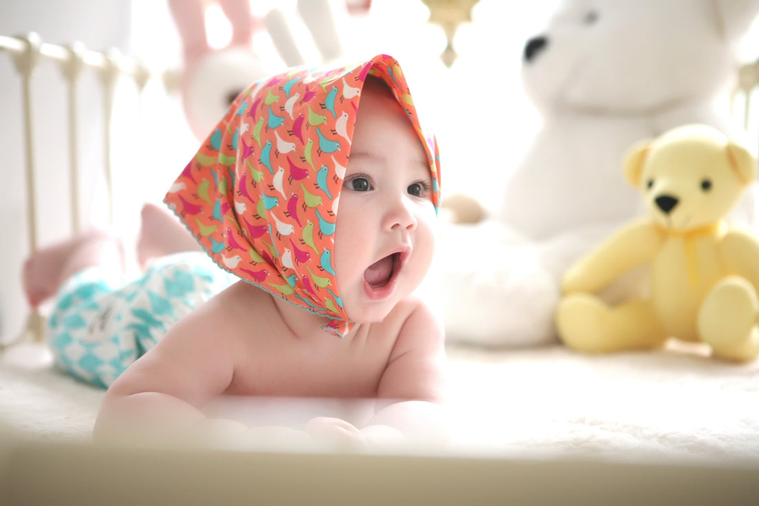 A baby with their mouth wide open in awe.