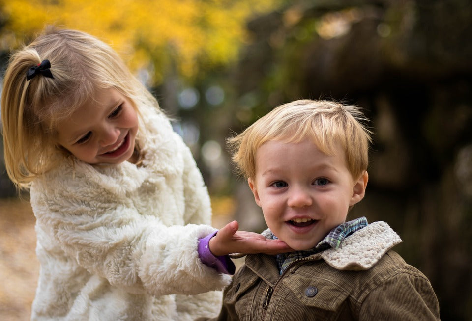 3-year-old boy and older sister lovely smile and talk with one another. At 3 years, your child's language will have an active vocabulary of around 300 words or more.