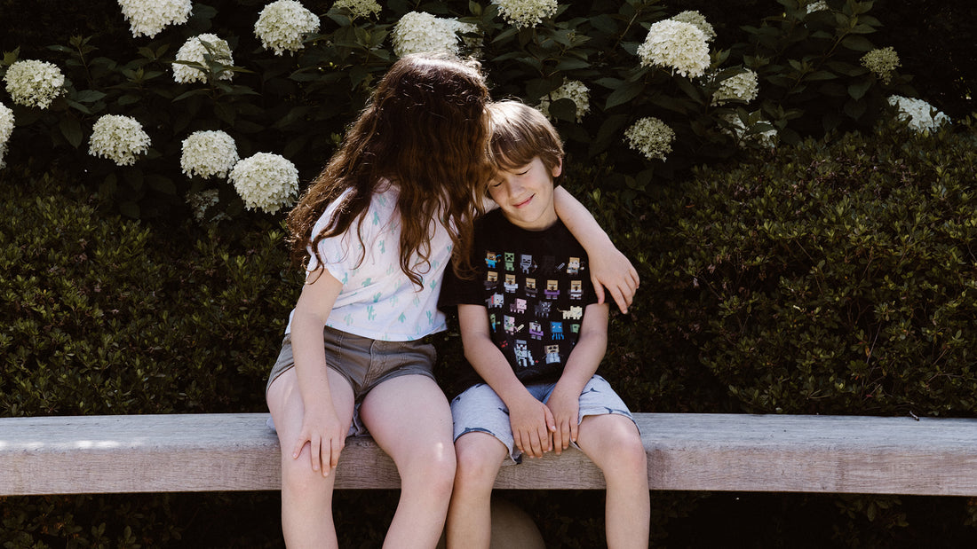 Sister kisses little brother on the forehead to make up after a conflict